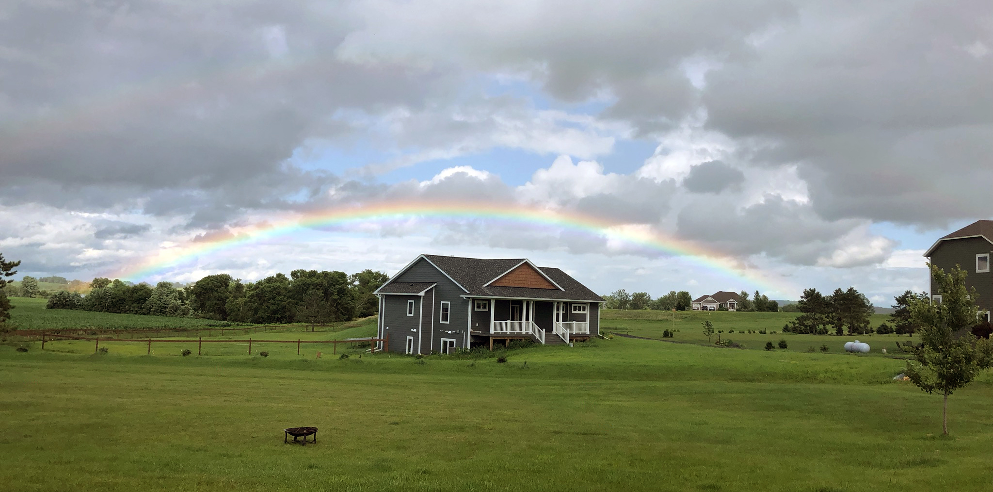 Double rainbow over house